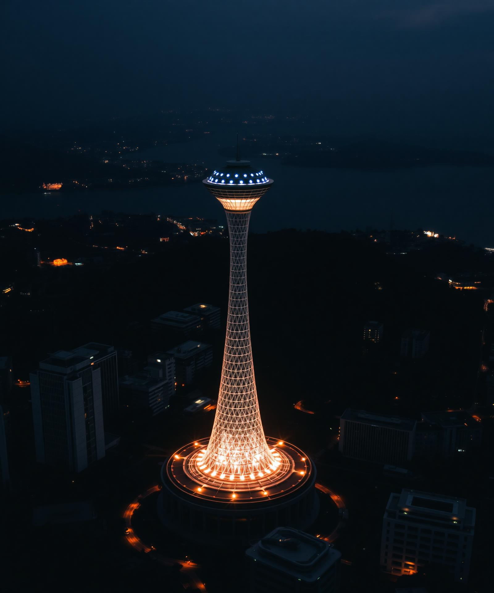 Batumi skyline at night with the iconic illuminated technological university tower above the Black Sea coast